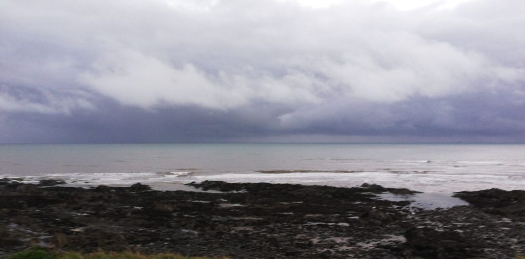 A photo of a stony shore on a cloudy day